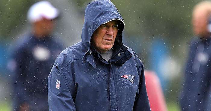 Belichick donning his iconic hoodie during a Patriots practice.