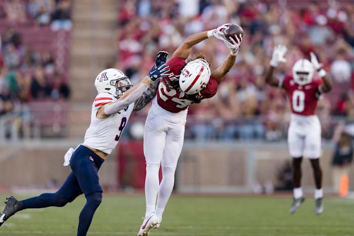 Sep 23, 2023; Stanford, California, USA; Arizona Wildcats safety Gunner Maldonado (9) defends as Stanford Cardinal wide receiver Tiger Bachmeier (24) catches a thirty-five yard pass during the third quarter at Stanford Stadium. Mandatory Credit: John Hefti-USA TODAY Sports