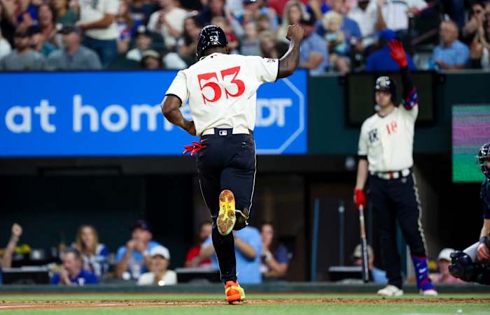 Sep 23, 2023; Arlington, Texas, USA; Texas Rangers right fielder Adolis Garcia (53) reacts while scoring during the fourth inning against the Seattle Mariners at Globe Life Field. Mandatory Credit: Kevin Jairaj-USA TODAY Sports