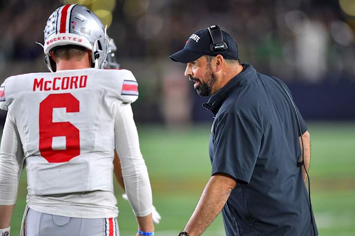 Ohio State Buckeyes head coach Ryan Day talks to quarterback Kyle McCord (6) in the second quarter against the Notre Dame Fighting Irish at Notre Dame Stadium.