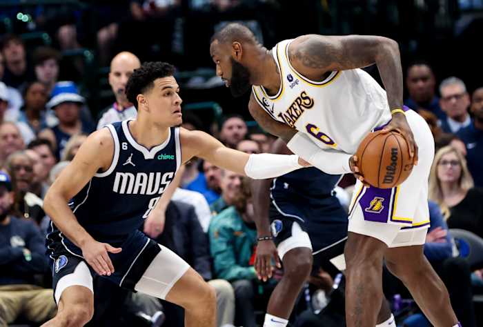 Dallas Mavericks’ Josh Green takes on the tough assignment of guarding Los Angeles Lakers star LeBron James.