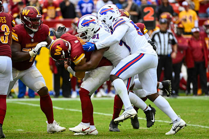 Washington Commanders quarterback Sam Howell gets sacked against the Buffalo Bills Sunday at FedExField. The Bills won 37-3.