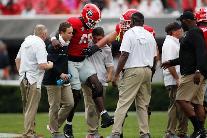Amarius Mims is carried off against South Carolina in week 3 of the 2023 season / Photo - Joshua Jones
