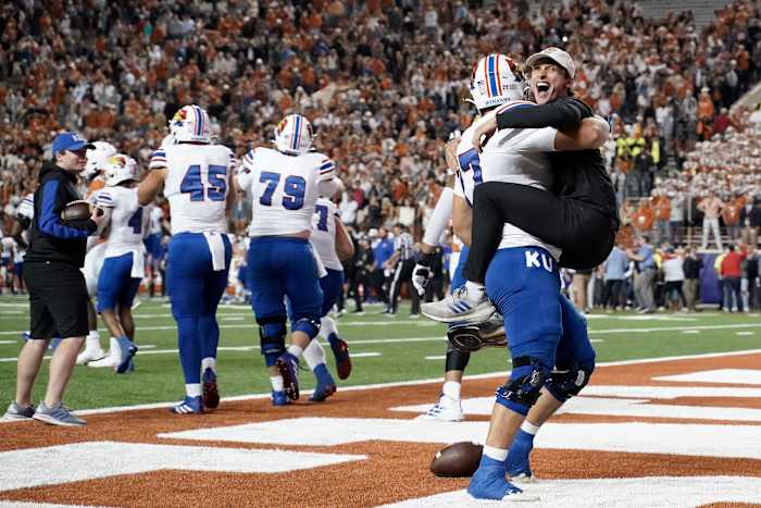 Kansas celebrates their 57-56 upset win over the Longhorns in Austin in 2021