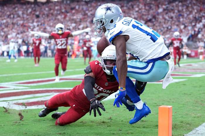 Dallas Cowboys wide receiver Michael Gallup (13) attempts to catch a pass against the Arizona Cardinals at State Farm Stadium Sunday.