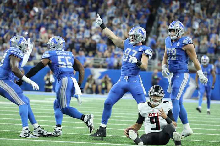 Detroit Lions defensive end Aidan Hutchinson (97) celebrates after linebacker Derrick Barnes (55) sacked Atlanta Falcons quarterback Desmond Ridder (9) during first half action Sunday, Sept. 24 2023.
