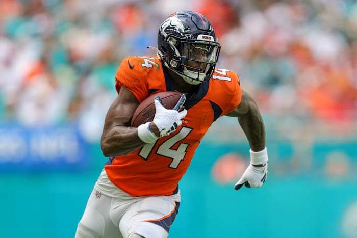 Sep 24, 2023; Miami Gardens, Florida, USA; Denver Broncos wide receiver Courtland Sutton (14) runs with the ball against the Miami Dolphins in the third quarter at Hard Rock Stadium.