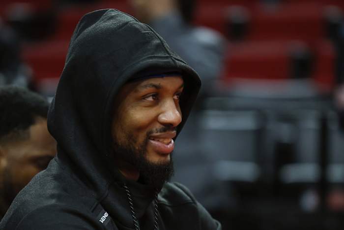 Portland Trail Blazers point guard Damian Lillard (0) watches players warm up