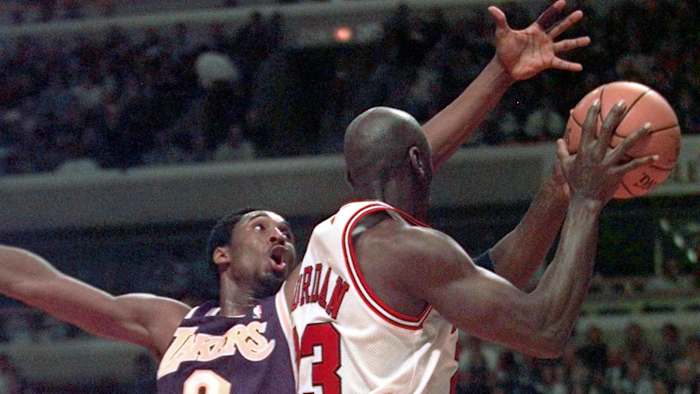 LA's Kobe Bryant, left, tries to stop Chicago's Michael Jordan (23) in the second half.