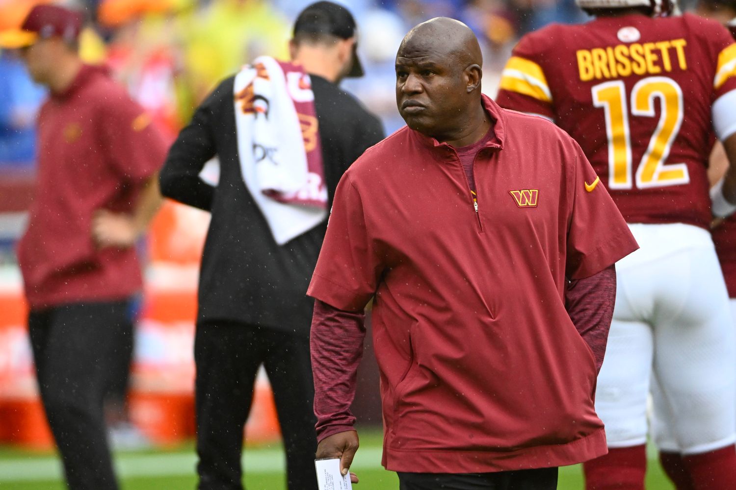 Washington Commanders offensive coordinator Eric Bieniemy on the field before the game against the Buffalo Bills at FedExField.