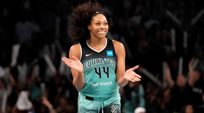 New York Liberty forward Betnijah Laney smiles after hitting a 3-pointer against the Connecticut Sun during the WNBA playoffs.