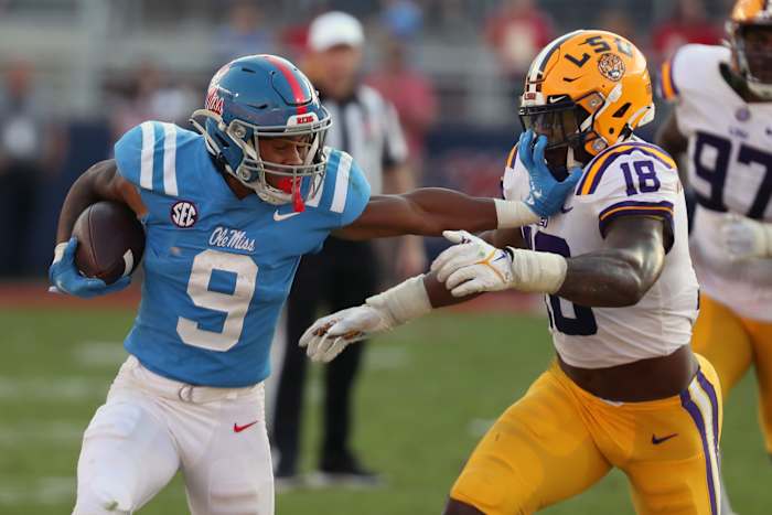 Oct 23, 2021; Oxford, Mississippi, USA; Mississippi Rebels running back Jerrion Ealy (9) and LSU Tigers linebacker Damone Clark (18) during the second half at Vaught-Hemingway Stadium. Mandatory Credit: Petre Thomas-USA TODAY Sports
