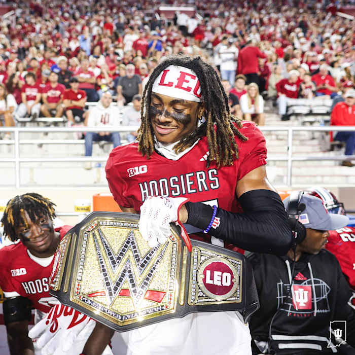Indiana cornerback Nic Toomer poses with the WWE takeaway belt after his interception against Indiana State.