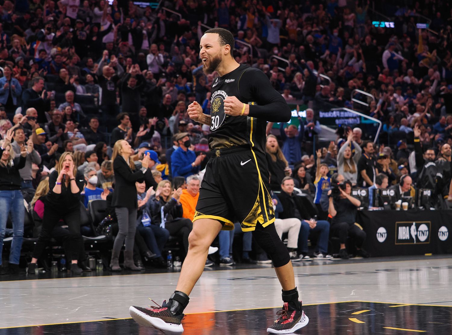 Golden State Warriors guard Stephen Curry celebrates after a play.