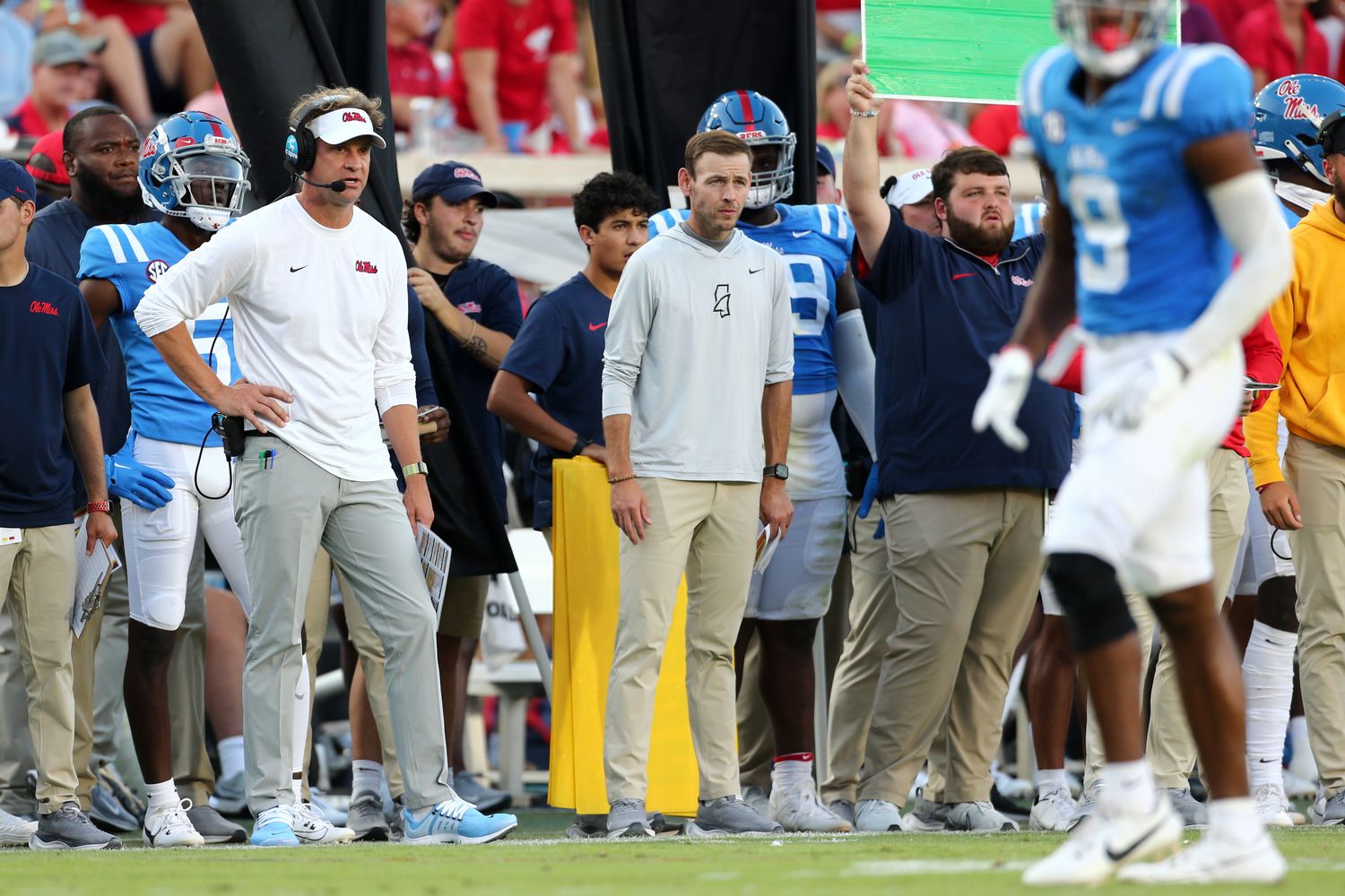 Sep 30, 2023; Oxford, Mississippi, USA; Ole Miss Rebels head coach Lane Kiffin (left) watches from the sidelines during the first half against the LSU Tigers at Vaught-Hemingway Stadium. Mandatory Credit: Petre Thomas-USA TODAY Sports