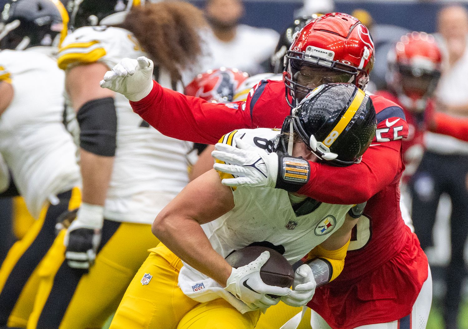Houston Texans edge rusher Jerry Hughes sacks Pittsburgh Steelers quarterback Kenny Pickett.