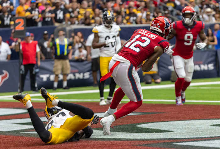 Houston Texans wide receiver Nico Collins (12) scores a touchdown in the first quarter against the Pittsburgh Steelers Sunday at NRG Stadium. Houston won 30-6.