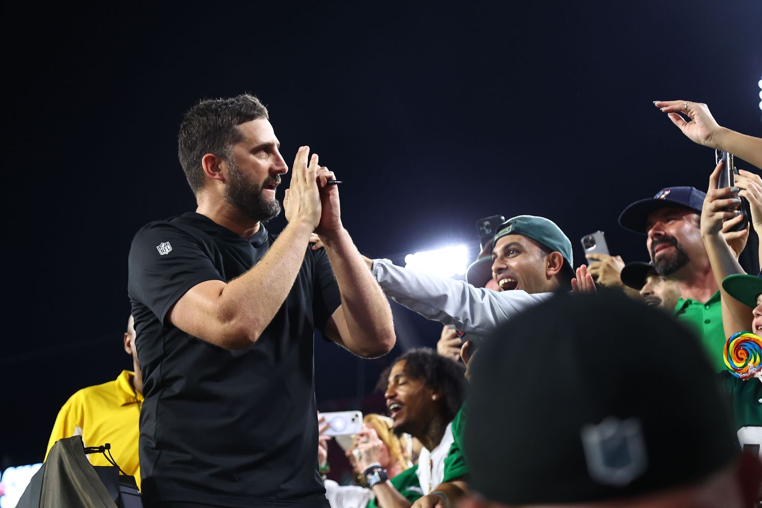 Philadelphia Eagles head coach Nick Sirianni celebrates with the fans.