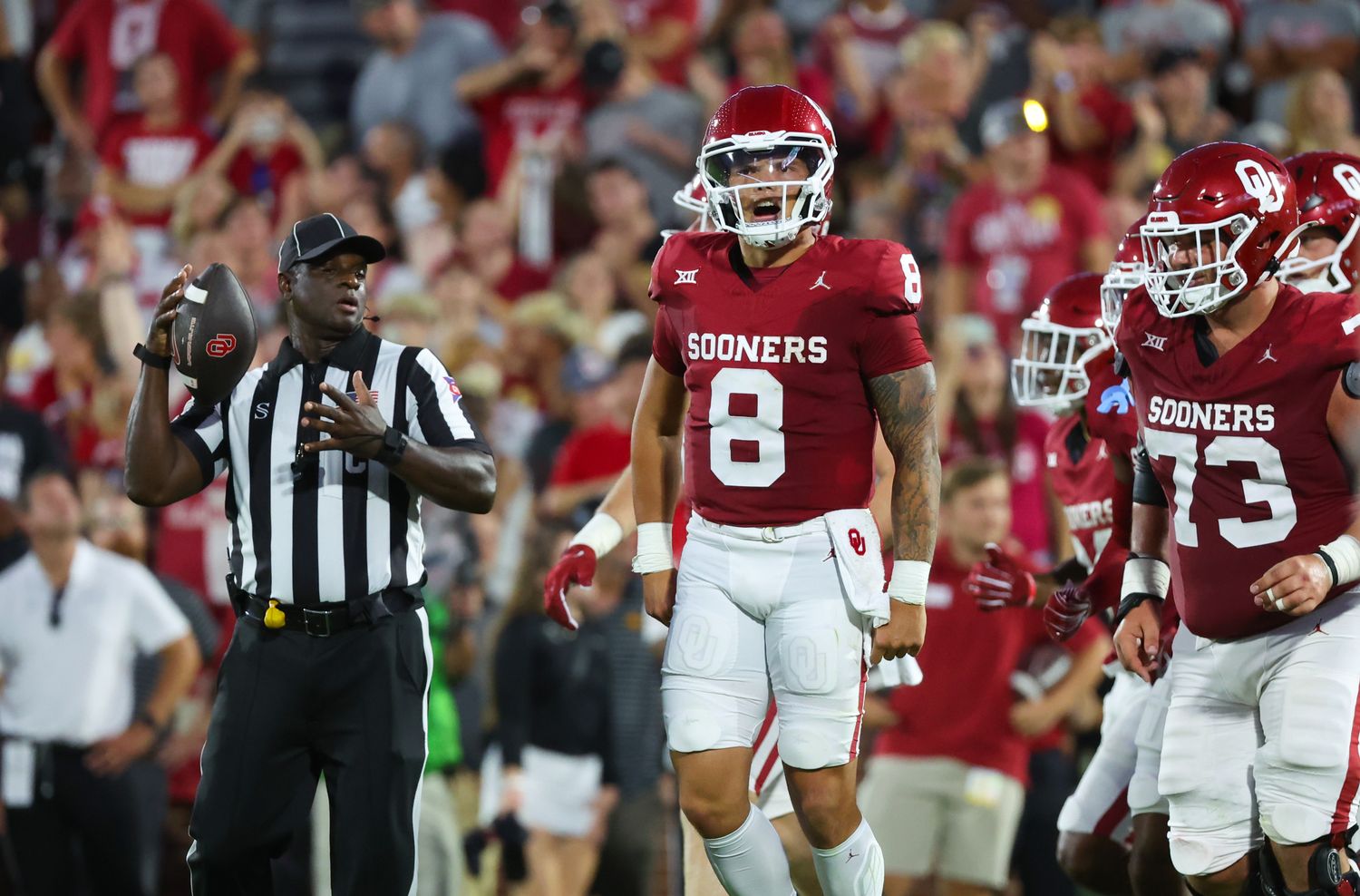 Oklahoma Sooners quarterback Dillon Gabriel (8) celebrates with teammates after scoring a touchdown during the first half against the Iowa State Cyclones at Gaylord Family-Oklahoma Memorial Stadium.