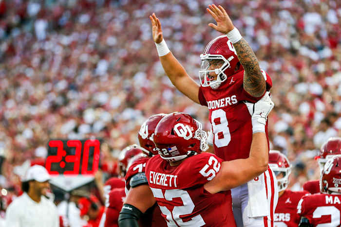 Oklahoma's Dillon Gabriel (8) celebrates scoring a touchdown with Oklahoma s Troy Everett (52) in the first quarter during an NCAA football game between University of Oklahoma (OU) and Iowa State