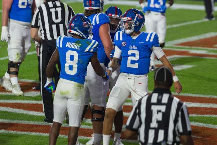 Nov 14, 2020; Oxford, Mississippi, USA; Mississippi Rebels quarterback Matt Corral (2) and wide receiver Elijah Moore (8) celebrate during the first half against the South Carolina Gamecocks at Vaught-Hemingway Stadium. Mandatory Credit: Justin Ford-USA TODAY Sports