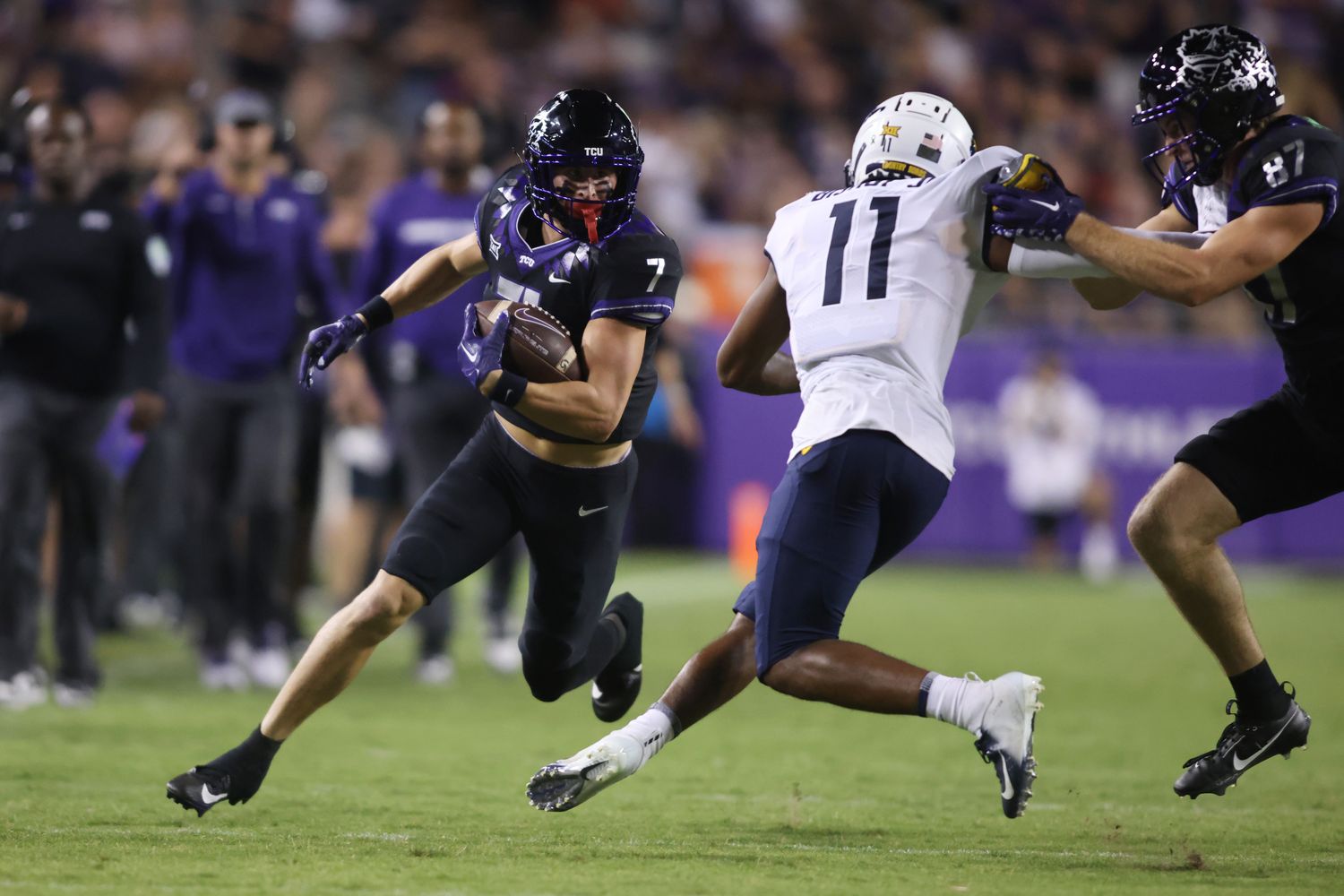 Sep 30, 2023; Fort Worth, Texas, USA; TCU Horned Frogs quarterback Chandler Morris (4) runs the ball against West Virginia Mountaineers cornerback Beanie Bishop Jr. (11) in the second quarter at Amon G. Carter Stadium. Mandatory Credit: Tim Heitman-USA TODAY Sports