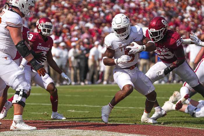 Oct 8, 2022; Dallas, Texas, USA: Texas Longhorns running back Bijan Robinson (5) steps into the endzone for a touchdown against the Oklahoma Sooners during the annual Red River Showdown at the Cotton Bowl.
