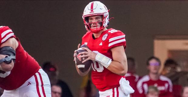 Nebraska Cornhuskers quarterback Henrich Haarberg attempts a pass during a college football game in the Big Ten.