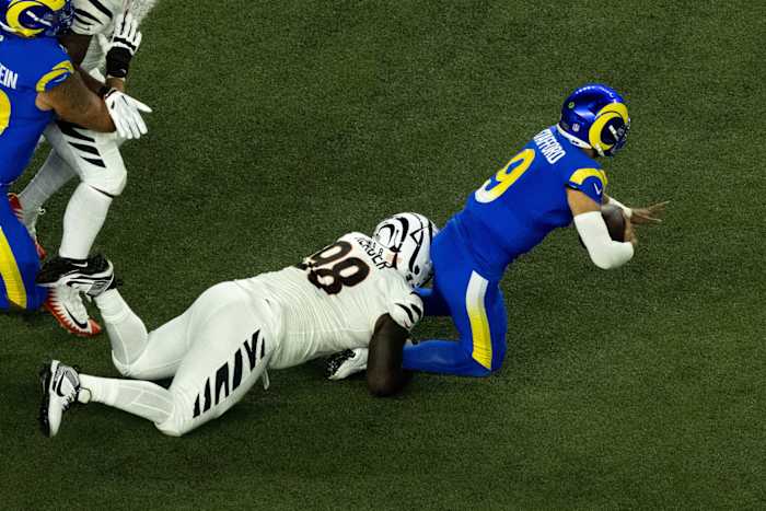 Sep 25, 2023; Cincinnati, Ohio, USA; Cincinnati Bengals defensive tackle DJ Reader (98) sacks Los Angeles Rams quarterback Matthew Stafford (9) in the first quarter of the NFL game between the Cincinnati Bengals and Los Angeles Rams at Paycor Stadium. Mandatory Credit: Albert Cesare-USA TODAY Sports