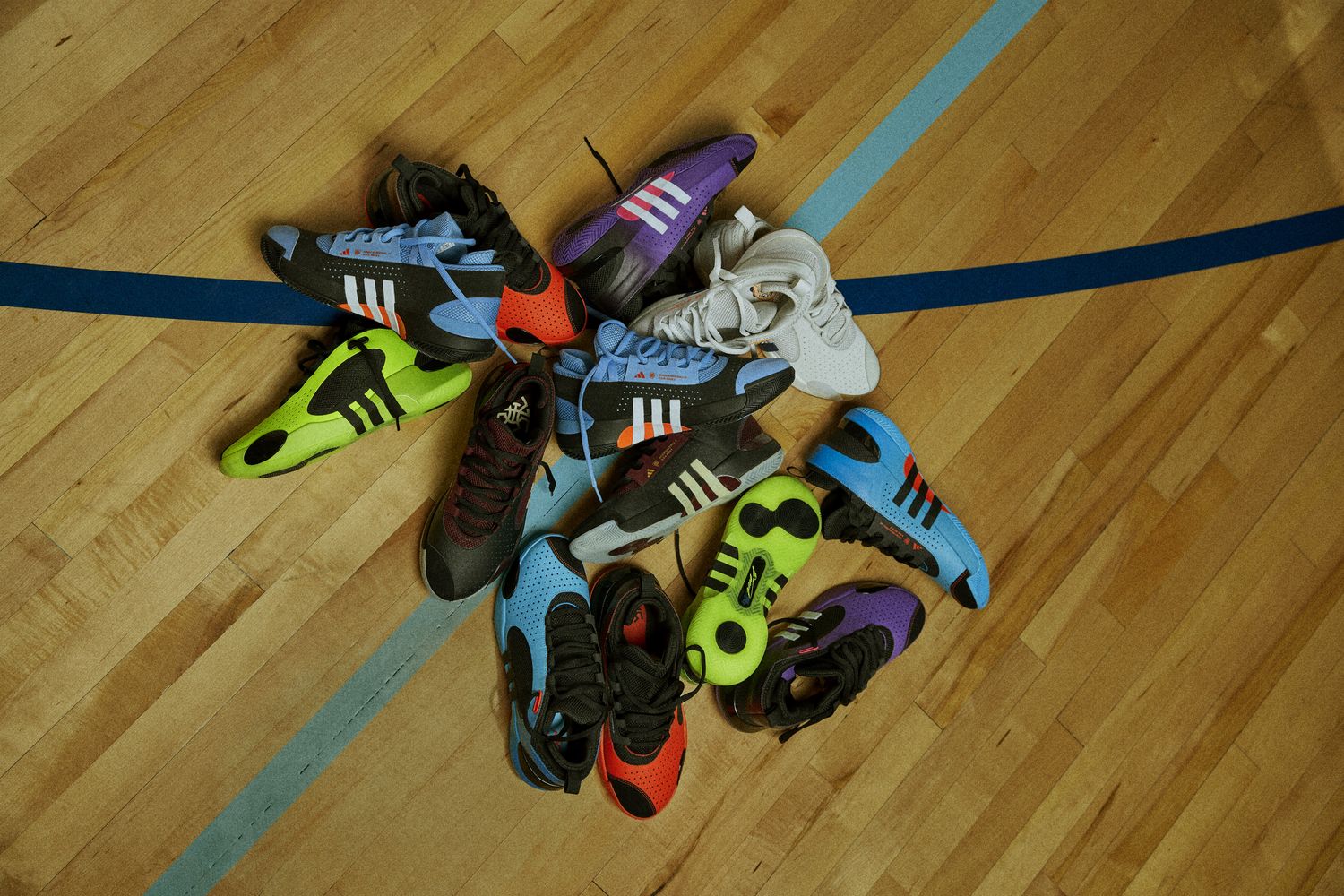 A pile of Donovan Mitchell's multicolor basketball shoes.