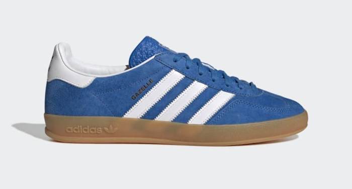 Side view of blue and white adidas sneakers.