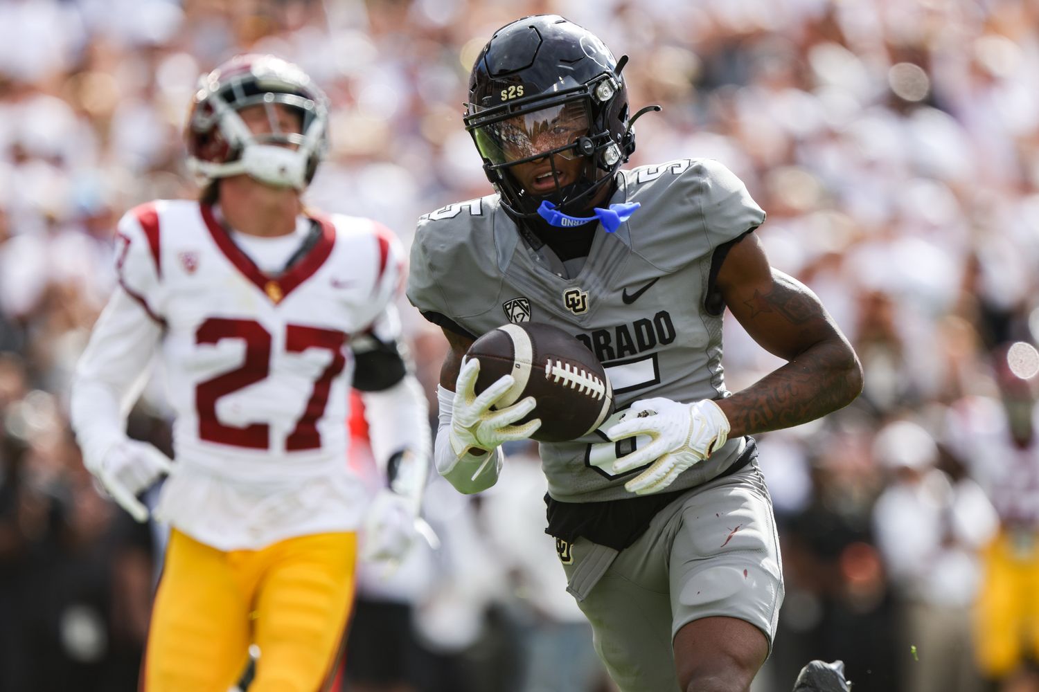 Colorado Buffaloes wide receiver Jimmy Horn Jr. (5) runs the ball in for a touchdown in the second quarter of the game against the USC Trojans at Folsom Field