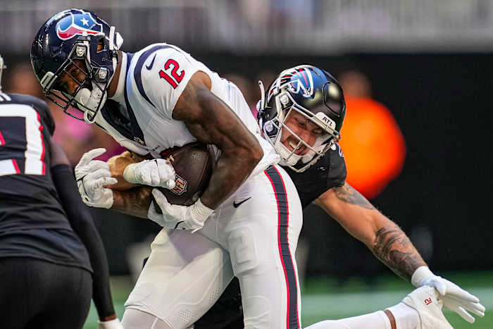 Houston Texans wide receiver Nico Collins (12) runs against Atlanta Falcons linebacker Nate Landman (53).
