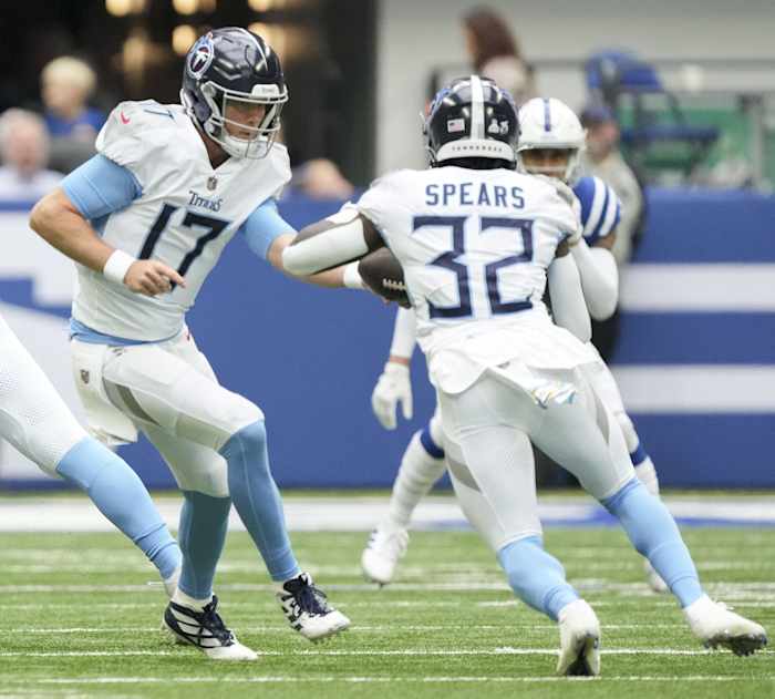 Tennessee Titans quarterback Ryan Tannehill (17) hands the ball to Tennessee Titans running back Tyjae Spears (32) on Sunday, Oct. 8, 2023, during a game against the Tennessee Titans at Lucas Oil Stadium.