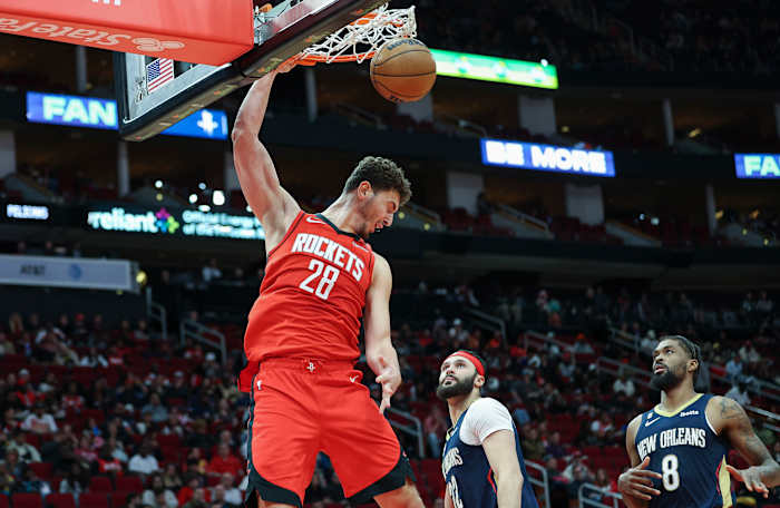 Rockets center Alperen Sengun dunks the ball during the third quarter against the Pelicans.