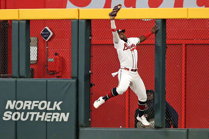 Oct 9, 2023; Cumberland, Georgia, USA; Atlanta Braves center fielder Michael Harris II (23) makes a catch at the wall for an out during the ninth inning against the Philadelphia Phillies in game two of the NLDS for the 2023 MLB playoffs at Truist Park.