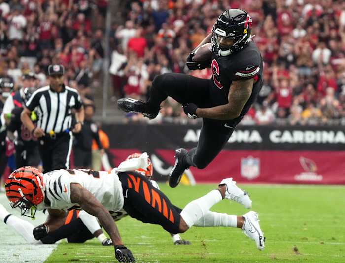 Arizona Cardinals running back James Conner (6) dives for extra yards against the Cincinnati Bengals at State Farm Stadium in Glendale on Oct. 8, 2023.
