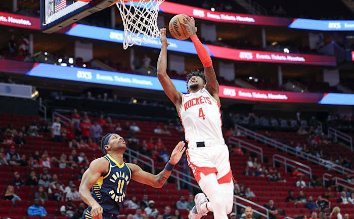 Rockets guard Jalen Green (4) shoots the ball as Indiana Pacers forward Bruce Brown (11) defends during the first quarter at Toyota Center.