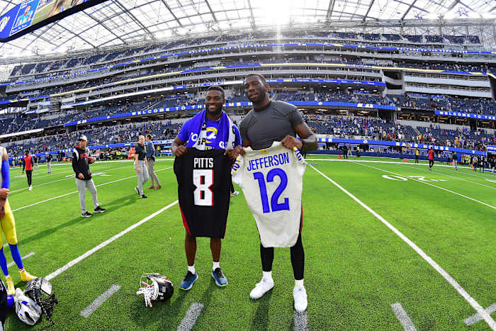 Los Angeles Rams wide receiver Van Jefferson (12) and Atlanta Falcons tight end Kyle Pitts (8) exchange jerseys following the game at SoFi Stadium.