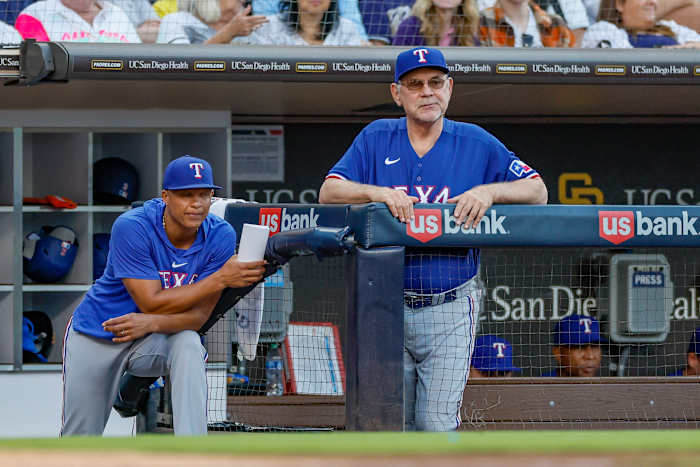 Jul 29, 2023; San Diego, California, USA; Texas Rangers manager Bruce Bochy (15) and associate manager Will Venable (83) watch on as San Diego Padres starting pitcher Yu Darvish (11) pitches during the fifth inning against the San Diego Padres at Petco Park.