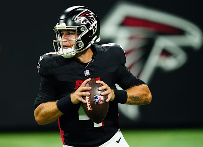Aug 18, 2023; Atlanta, Georgia, USA; Atlanta Falcons quarterback Taylor Heinicke (4) rolls out to pass against the Cincinnati Bengals during the third quarter at Mercedes-Benz Stadium.