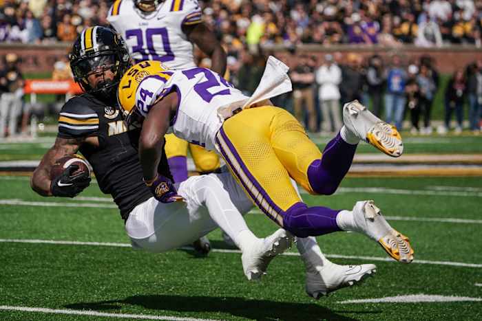 Oct 7, 2023; Columbia, Missouri, USA; Missouri Tigers wide receiver Theo Wease Jr. (1) runs the ball and is tackled by LSU Tigers cornerback Zy Alexander (24) during the first half at Faurot Field at Memorial Stadium. Mandatory Credit: Denny Medley-USA TODAY Sports