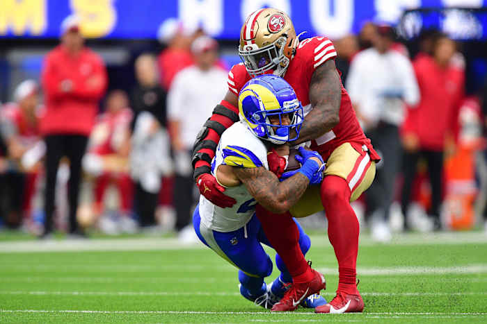 Sep 17, 2023; Inglewood, California, USA; Los Angeles Rams running back Kyren Williams (23) is brought down by San Francisco 49ers linebacker Dre Greenlaw (57) during the first half at SoFi Stadium. Mandatory Credit: Gary A. Vasquez-USA TODAY Sports