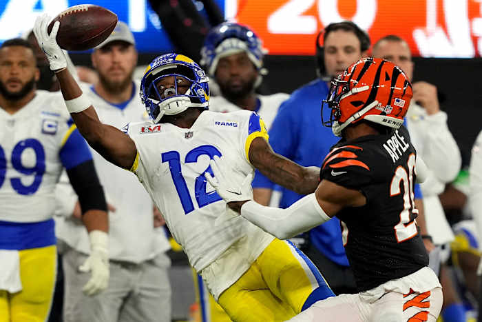 Los Angeles Rams wide receiver Van Jefferson (12) stretches for a deep pass as Cincinnati Bengals cornerback Eli Apple (20) defends in the fourth quarter during Super Bowl 56, Sunday, Feb. 13, 2022, at SoFi Stadium in Inglewood, Calif.