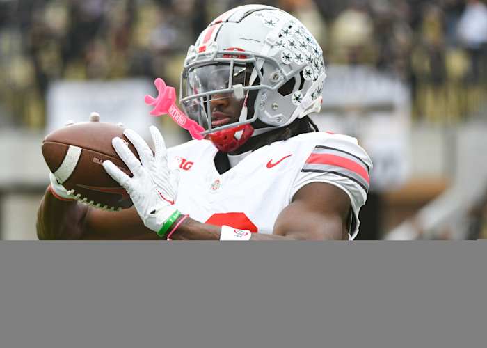 Ohio State Buckeyes wide receiver Marvin Harrison Jr. (18) catches a pass during warmups prior to the game at Ross-Ade Stadium.