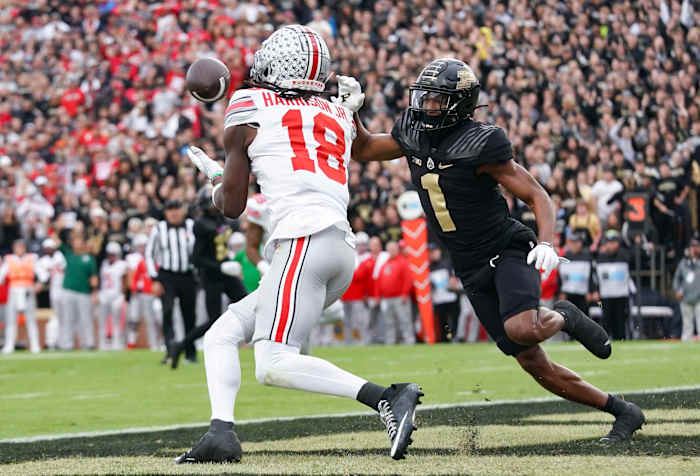 Oct 14, 2023; West Lafayette, Indiana, USA; Ohio State Buckeyes wide receiver Marvin Harrison Jr. (18) catches a pass for a touchdown against Purdue Boilermakers defensive back Markevious Brown (1) during the first half at Ross-Ade Stadium.