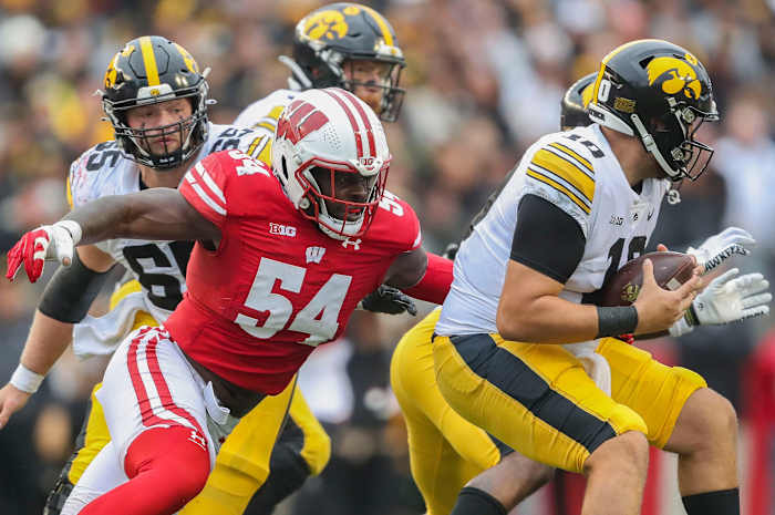 Wisconsin linebacker Jordan Turner (54) sacks Iowa quarterback Deacon Hill (10) on Saturday, October 14, 2023, at Camp Randall Stadium in Madison, Wis. Iowa won the game, 12-6.