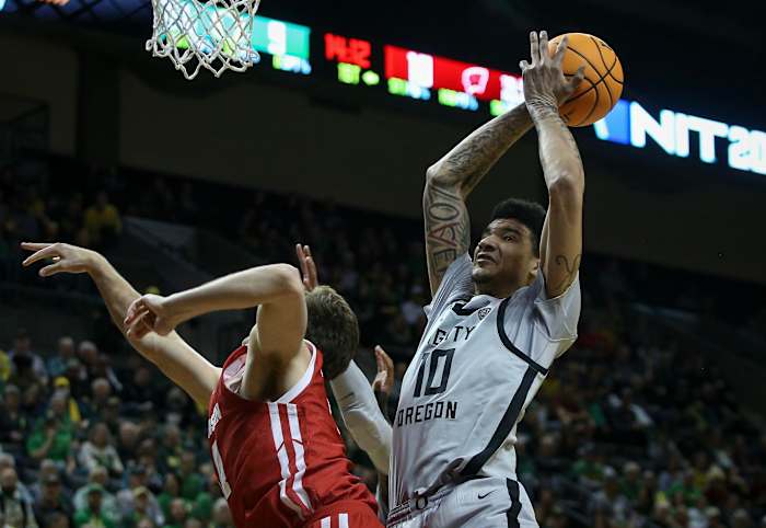 Oregon center Kel'el Ware drags down a rebound as the Oregon Ducks host Wisconsin in the quarterfinal round of the NIT Tuesday, March 21, 2023 at Matthew Knight Arena in Eugene, Ore.