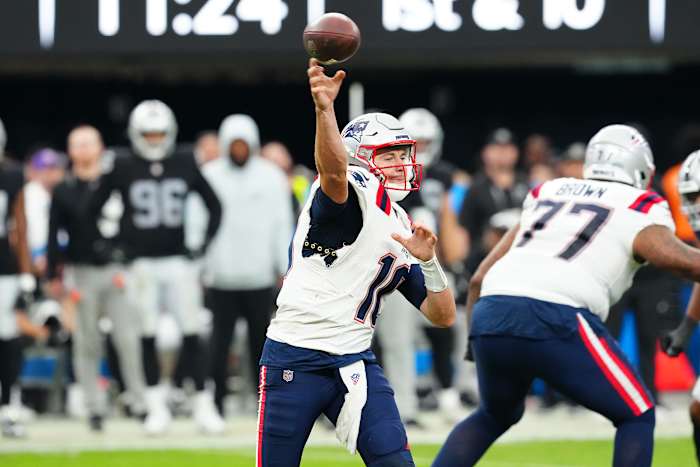 New England Patriots quarterback Mac Jones (10) makes a pass attempt against the Las Vegas Raiders during the fourth quarter at Allegiant Stadium.