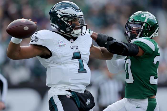 Philadelphia Eagles quarterback Jalen Hurts (1) looks to pass against New York Jets cornerback Michael Carter II (30) during the first quarter at MetLife Stadium.